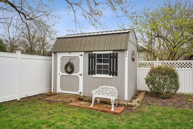 view of shed with a fenced backyard