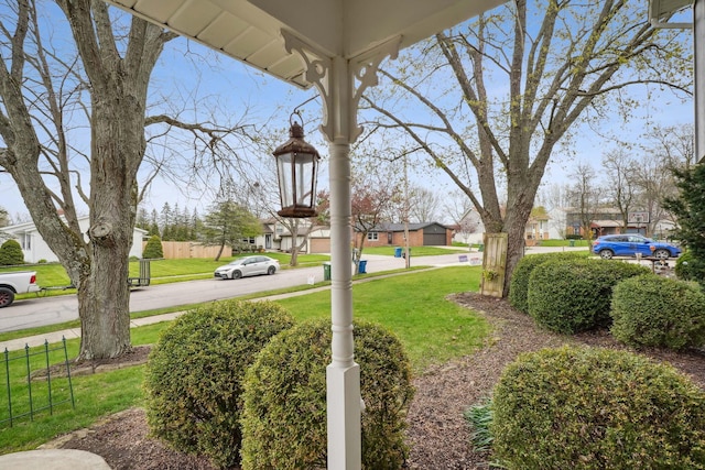 view of yard with fence and a residential view