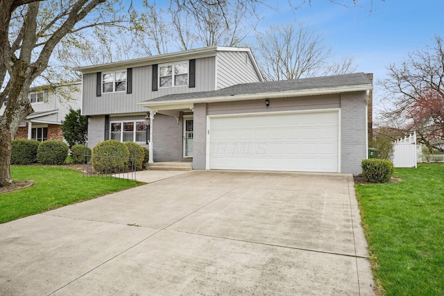 traditional-style home featuring concrete driveway, a front yard, brick siding, and a garage