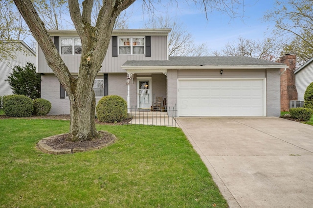 traditional home featuring driveway, a front lawn, and brick siding