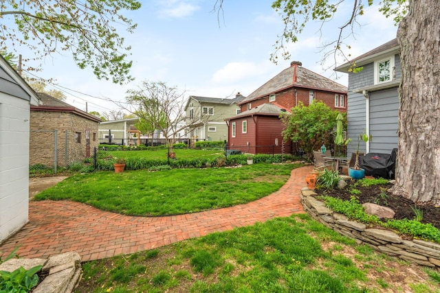 view of yard featuring a patio and fence