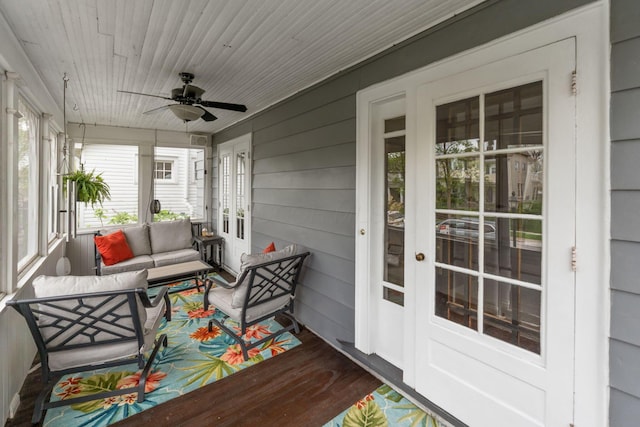 sunroom with french doors, a ceiling fan, and outdoor lounge area