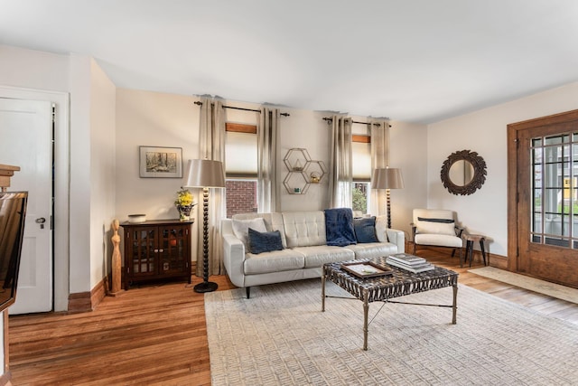 living area featuring wood finished floors and baseboards