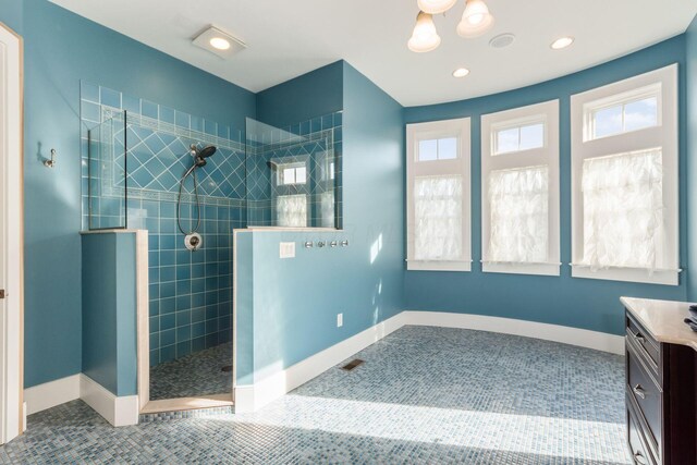16187 Kreashbaum Rd, Rockbridge, OH 43149 - bathroom with baseboards, walk in shower, vanity, and recessed lighting