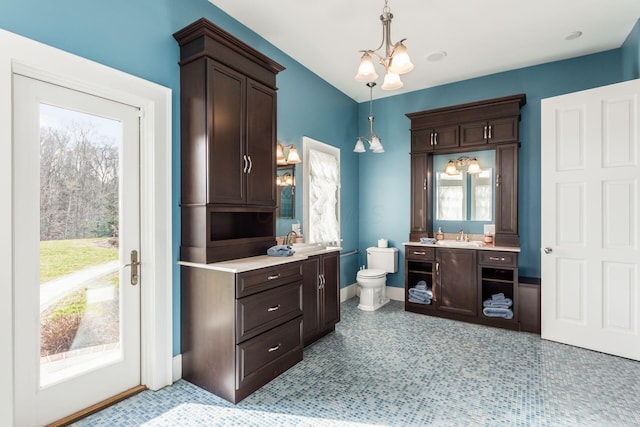 16187 Kreashbaum Rd, Rockbridge, OH 43149 - bathroom with two vanities, plenty of natural light, baseboards, and a sink