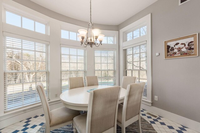 16187 Kreashbaum Rd, Rockbridge, OH 43149 - dining area featuring visible vents, baseboards, and a notable chandelier
