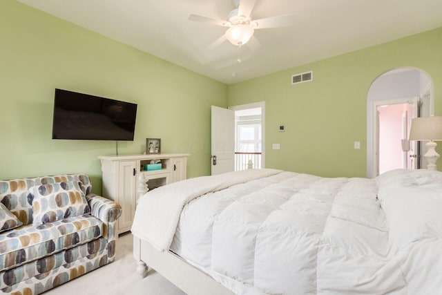 16187 Kreashbaum Rd, Rockbridge, OH 43149 - carpeted bedroom with arched walkways, visible vents, and ceiling fan