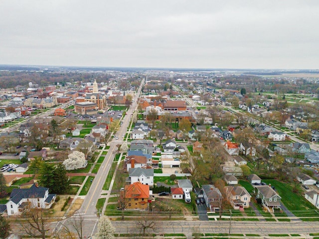 birds eye view of property with a residential view