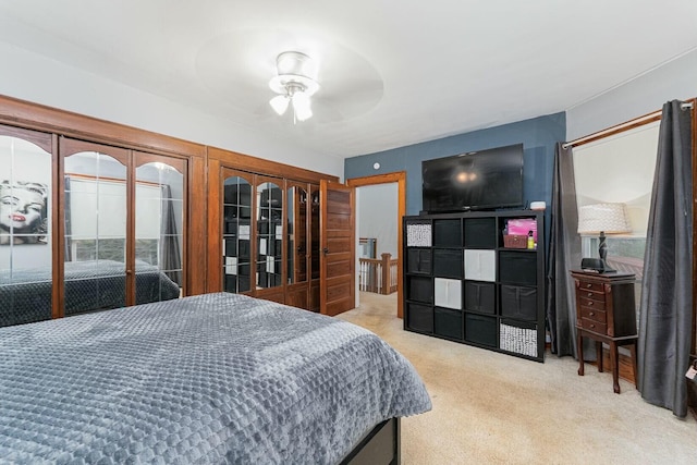 carpeted bedroom featuring ceiling fan and access to outside