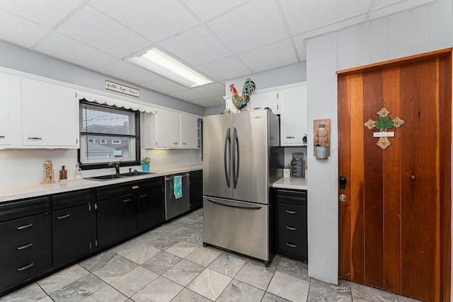 kitchen with light countertops, appliances with stainless steel finishes, and dark cabinetry