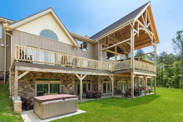16012 State Route 678, Rockbridge, OH 43149 - rear view of property featuring a hot tub, a patio area, a yard, a deck, and stone siding