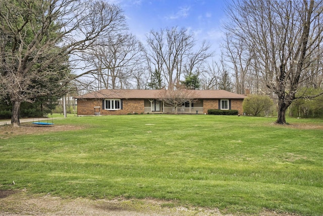11378 Ann Dr NW, Baltimore, OH 43105 - single story home with a chimney, a front yard, and brick siding