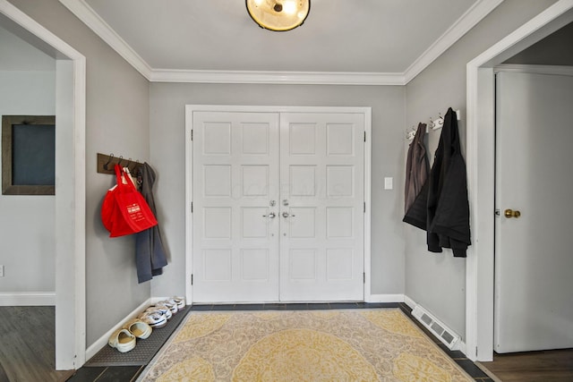 11378 Ann Dr NW, Baltimore, OH 43105 - foyer entrance featuring visible vents, baseboards, and ornamental molding