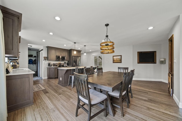 11378 Ann Dr NW, Baltimore, OH 43105 - dining room featuring recessed lighting, light wood-type flooring, and baseboards