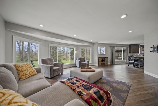 11378 Ann Dr NW, Baltimore, OH 43105 - living area with recessed lighting, baseboards, wood finished floors, and a healthy amount of sunlight
