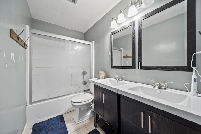 11378 Ann Dr NW, Baltimore, OH 43105 - full bath featuring tile patterned floors, shower / bath combination with glass door, double vanity, and a sink