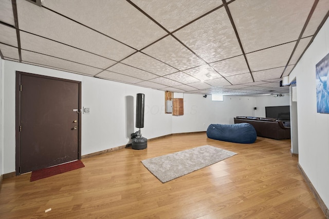 11378 Ann Dr NW, Baltimore, OH 43105 - living room featuring wood finished floors, baseboards, and a drop ceiling