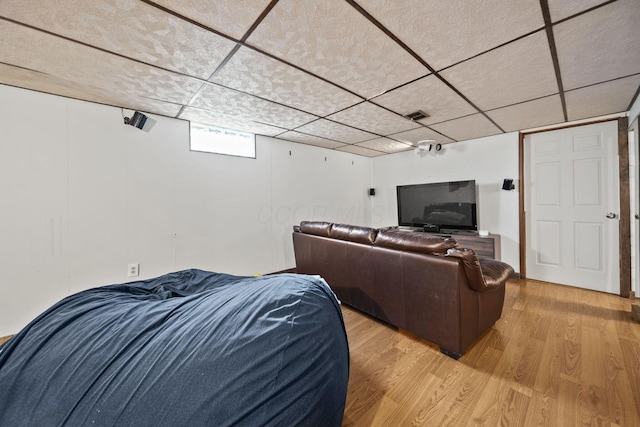 11378 Ann Dr NW, Baltimore, OH 43105 - living room featuring visible vents, light wood-style flooring, and a drop ceiling