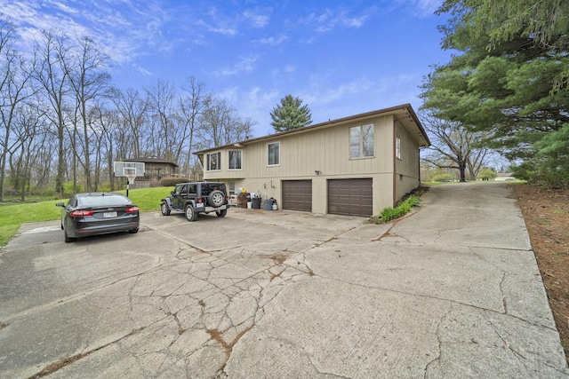 11378 Ann Dr NW, Baltimore, OH 43105 - view of home's exterior featuring a yard, a garage, and driveway