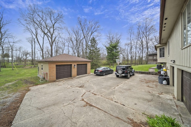 11378 Ann Dr NW, Baltimore, OH 43105 - exterior space featuring an outbuilding, brick siding, a yard, and a garage