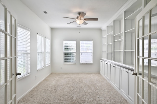 8050 Flint Run Pl, Columbus, OH 43235 - empty room with ceiling fan, light colored carpet, baseboards, and french doors