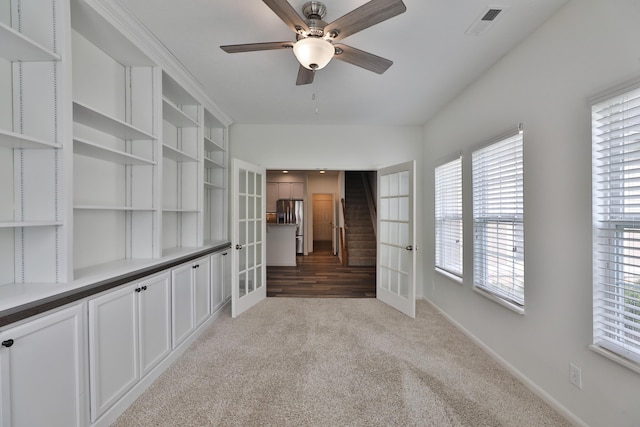 8050 Flint Run Pl, Columbus, OH 43235 - spare room featuring ceiling fan, light carpet, baseboards, and french doors