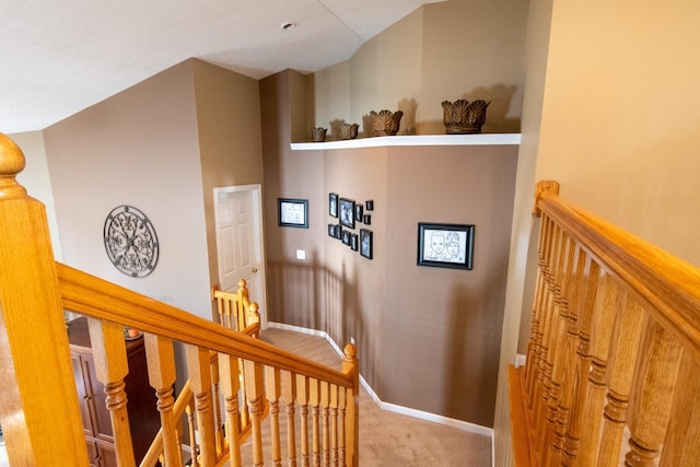 stairway with carpet floors and baseboards