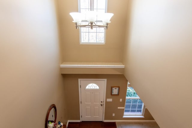 entryway with a notable chandelier
