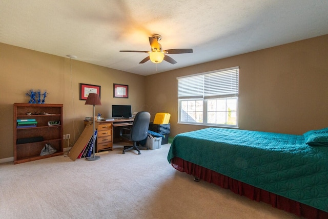 bedroom featuring a ceiling fan and light colored carpet