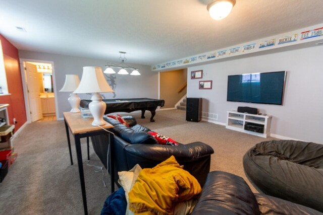 carpeted living area featuring baseboards, visible vents, pool table, and stairs