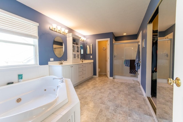 bathroom with a sink, double vanity, toilet, a whirlpool tub, and a shower stall