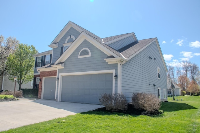view of property exterior with an attached garage, a shingled roof, driveway, and a yard