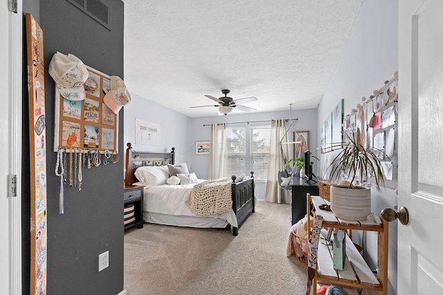 3379 Fishinger Mill Dr, Hilliard, OH 43026 - bedroom with carpet flooring, a textured ceiling, and a ceiling fan
