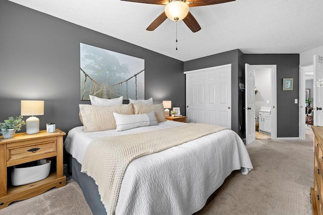 3379 Fishinger Mill Dr, Hilliard, OH 43026 - bedroom with light carpet, a closet, ceiling fan, baseboards, and ensuite bath