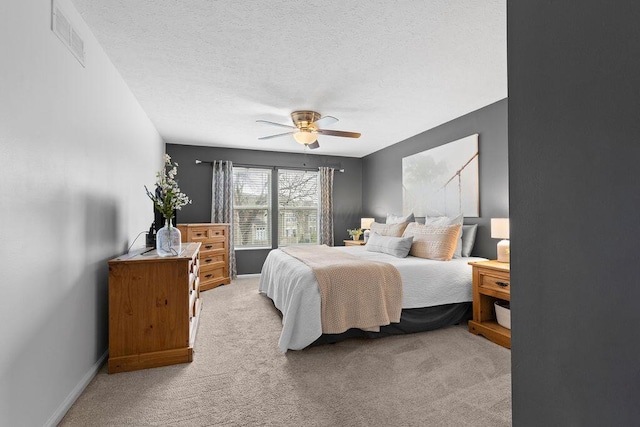 3379 Fishinger Mill Dr, Hilliard, OH 43026 - bedroom with light colored carpet, a textured ceiling, a ceiling fan, and baseboards