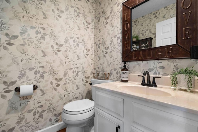 3379 Fishinger Mill Dr, Hilliard, OH 43026 - bathroom featuring wallpapered walls, vanity, and toilet