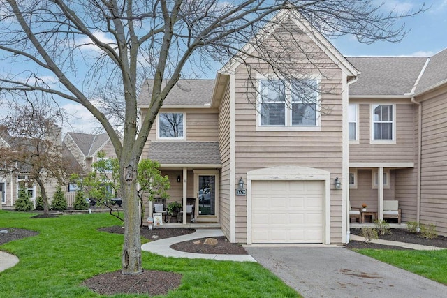 3379 Fishinger Mill Dr, Hilliard, OH 43026 - multi unit property featuring a front yard, an attached garage, driveway, and a shingled roof