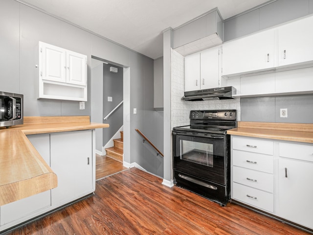 kitchen featuring black electric range oven, under cabinet range hood, stainless steel microwave, and open shelves