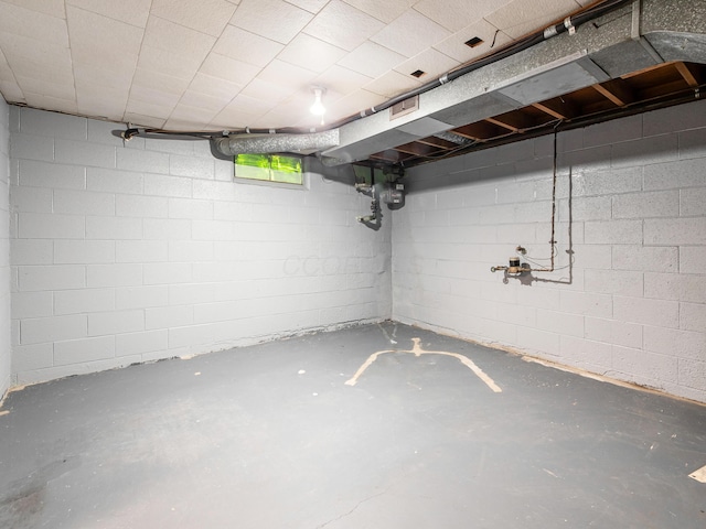 below grade area with concrete block wall