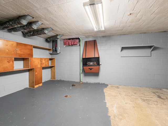 basement featuring concrete block wall