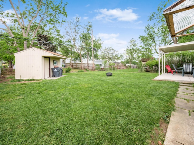 view of yard featuring a patio area and an outdoor structure