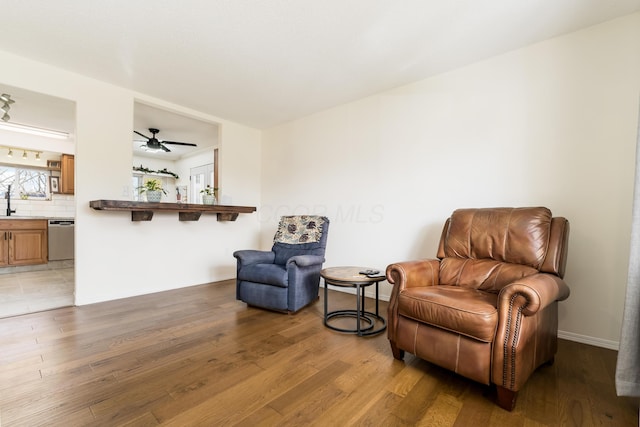1706 Kinross Ln, Galloway, OH 43119 - living area featuring light wood-style flooring, baseboards, and ceiling fan