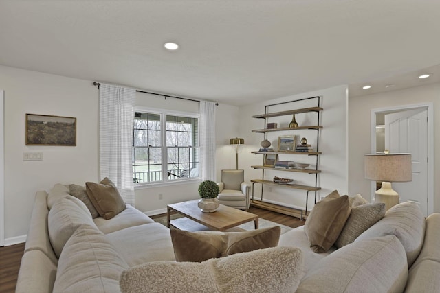 living area featuring baseboards, dark wood finished floors, and recessed lighting