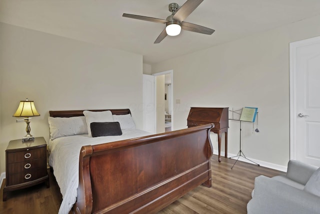 bedroom featuring wood finished floors, ceiling fan, and baseboards