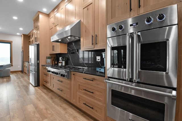 kitchen with tasteful backsplash, light wood-type flooring, recessed lighting, appliances with stainless steel finishes, and range hood