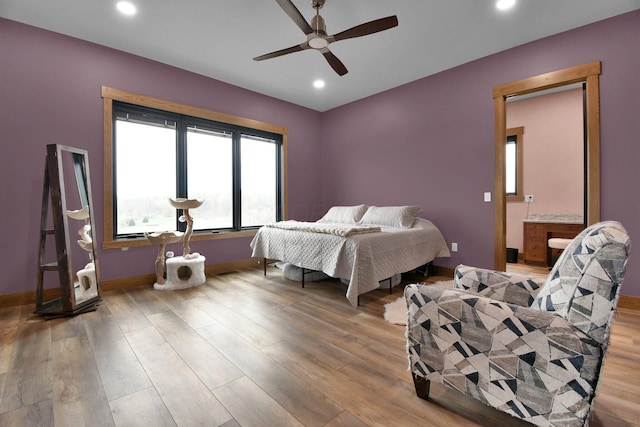 bedroom with ceiling fan, connected bathroom, recessed lighting, wood finished floors, and baseboards