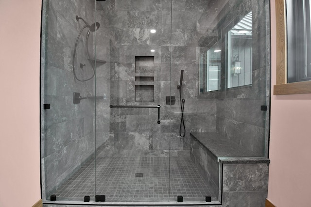 bathroom featuring a shower stall