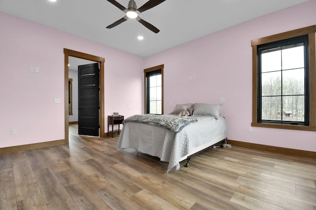 bedroom with recessed lighting, ceiling fan, baseboards, and wood finished floors