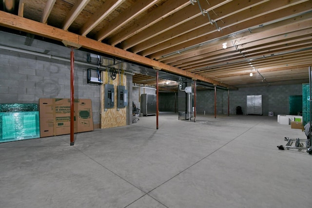 unfinished basement featuring electric panel