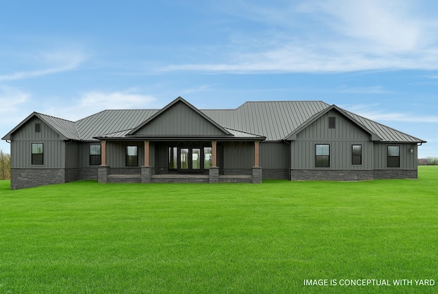 back of house with a yard, board and batten siding, metal roof, and a standing seam roof